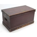 A Victorian painted pine storage trunk with hinged lift-lid, wrought-iron side handles, & on