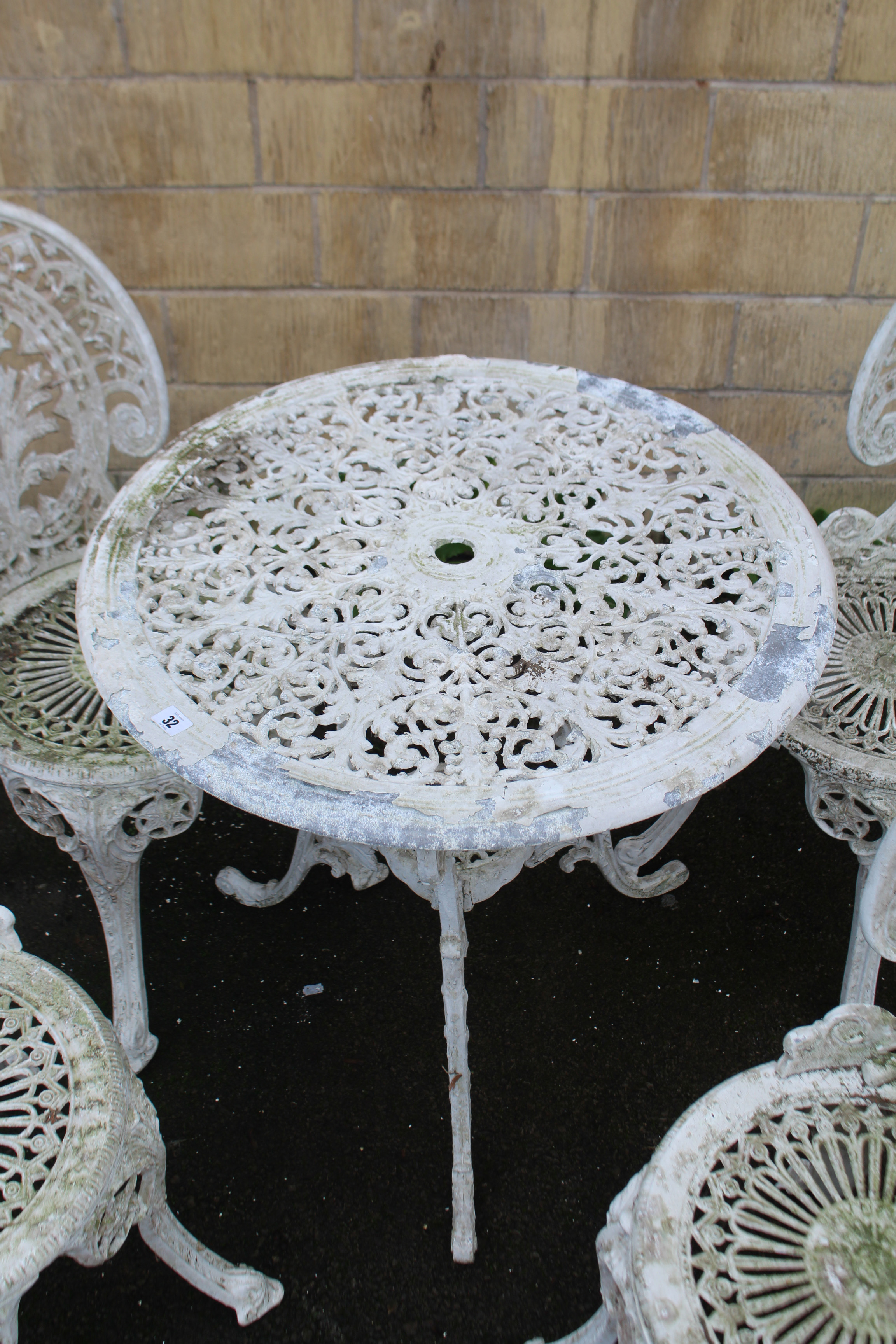 A Victorian-style white painted aluminium patio table with pierced circular top, & on three shaped - Image 3 of 3