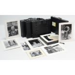 Four folios containing numerous black & white photographs.