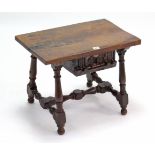 A Spanish-style oak rectangular low occasional table fitted centre frieze drawer, & on baluster-