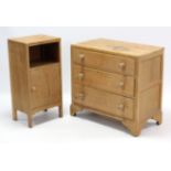 A light oak small chest, fitted three long graduated drawers, & on bracket feet, 31½” wide; & a