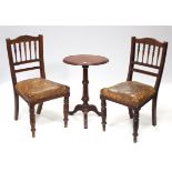 A Victorian mahogany oval tripod table on turned centre column & three cabriole legs, 18½” wide;