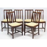 A set of six mid-20th century oak rail-back dining chairs with padded drop-in seats, & on square