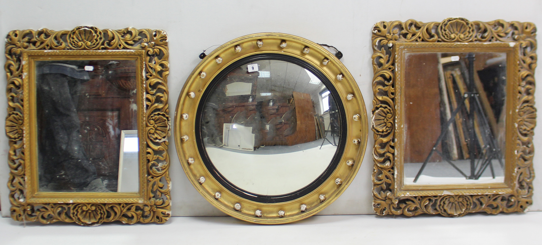 A regency-style gilt frame convex wall mirror with ebony inner-slip & sphere border, 24” diam.;