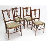 A set of four late Victorian beech splat-back dining chairs (including a pair of carvers), each with