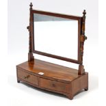 A 19th century mahogany rectangular swing toilet mirror fitted two small drawers to the bow-front