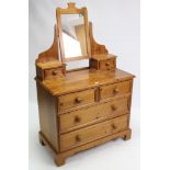 A pine dressing chest with rectangular swing mirror to the stage back, fitted two short & two long