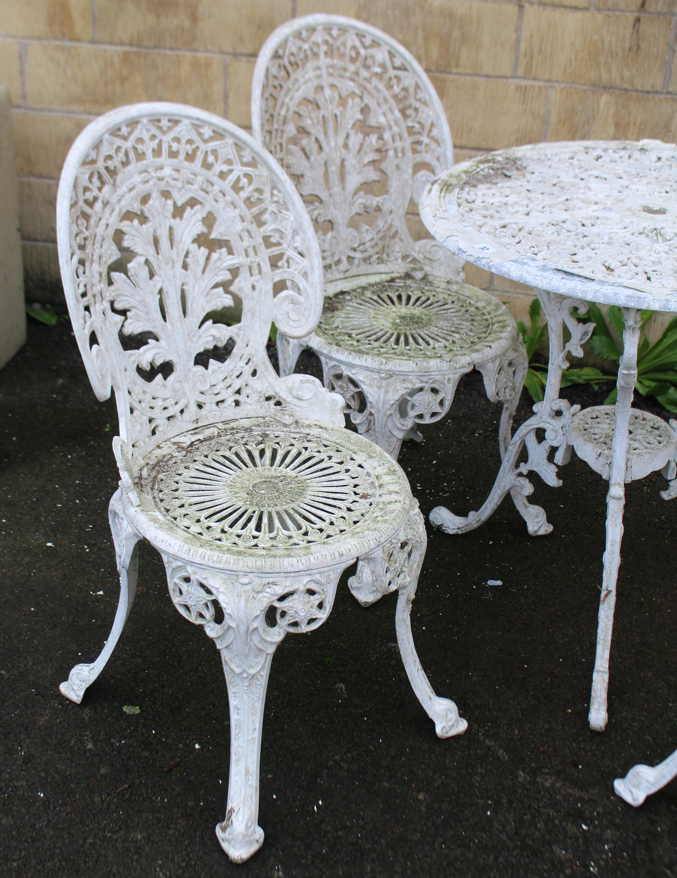 A Victorian-style white painted aluminium patio table with pierced circular top, & on three shaped - Image 2 of 3