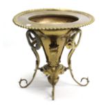 A Victorian-style ornate brass jardinière stand with trumpet-shaped centre column, & on four