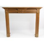 A pine fire surround with fluted frieze & square supports, 54½” wide x 45” high.