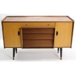 A 1960’s Beautility mahogany-finish dining room suite comprising a drop-leaf table, 33” x 53”; a set