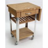 A light oak kitchen island, fitted frieze drawer with two open shelves below, & on silvered-metal