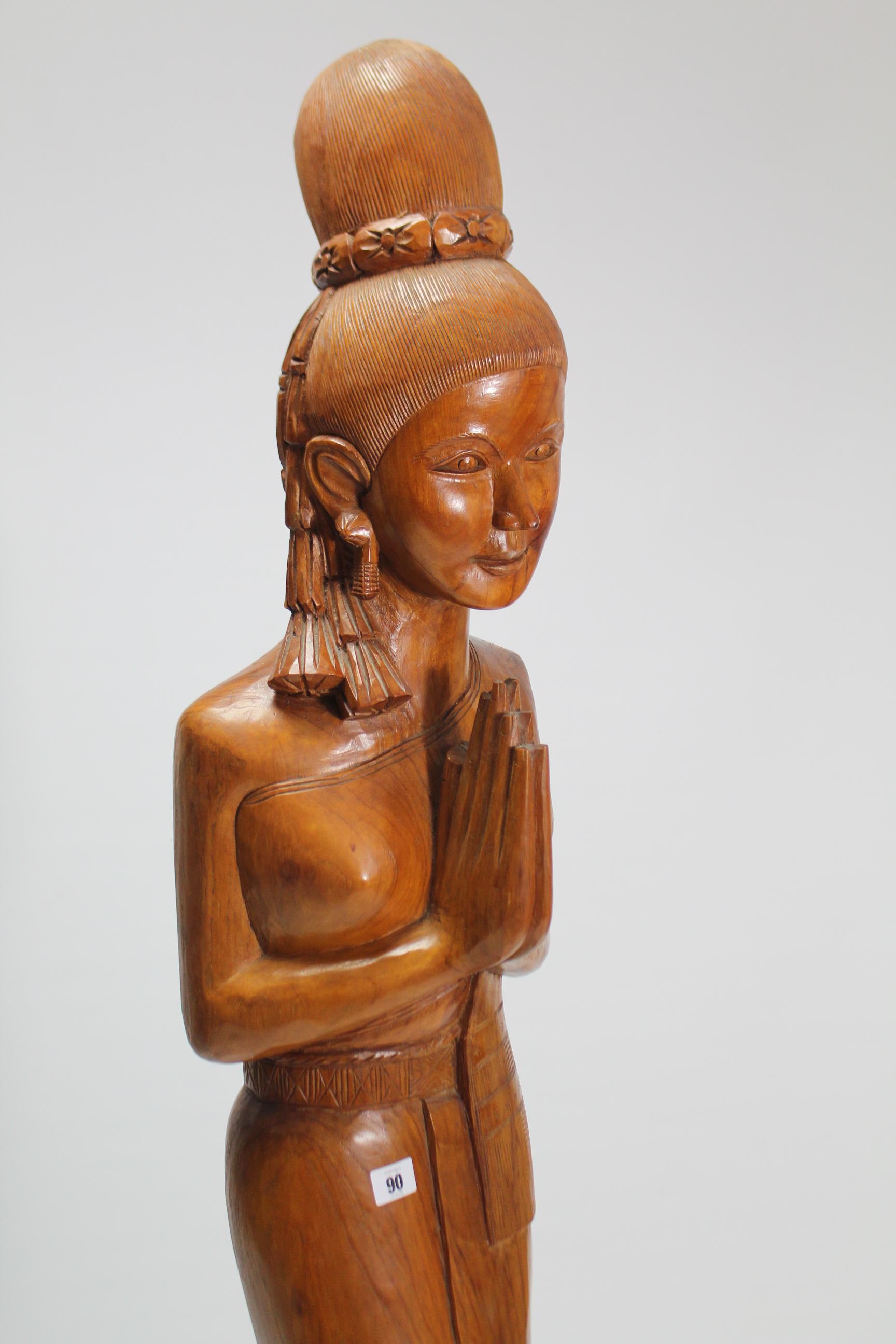 A large carved hardwood Thai female figure, 65¼” high. - Image 2 of 2
