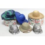 A Singapore pith helmet; two reproduction miners’ helmets; & three ladies hats with two cardboard