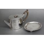 A George III silver oval straight-sided teapot, with flat hinged lid, beaded rim & boxwood scroll