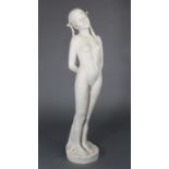 An early/mid 20th century Parian figure of a standing female nude, her eyes closed & head tilted,