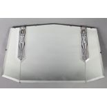 An Art Deco wall mirror of shaped rectangular form, the central bevelled plate flanked by chrome-