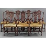 A set of eight Hepplewhite-style mahogany dining chairs, including a pair of carver chairs, the
