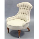 A Victorian nursing chair with shaped buttoned-back & circular seat upholstered pale green fabric,