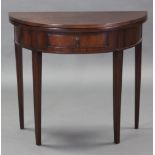 A George III mahogany demi-lune card table, the fold-over top inset green baize, fitted frieze