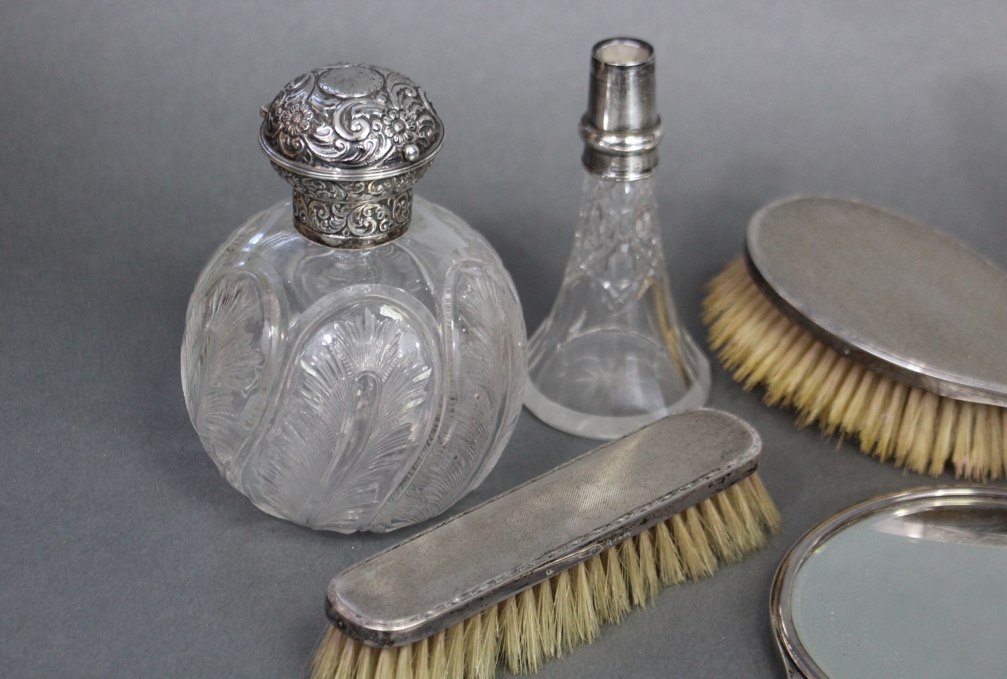 A late Victorian glass spherical toilet-water bottle with finely cut feather motifs, the embossed - Image 2 of 5