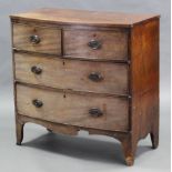 A Georgian mahogany bow-front chest, fitted two short & two long graduated drawers with oval brass