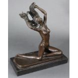 After C. Mirval; a cast bronze female nude figure, seated with hands lifting her flowing hair, on