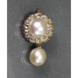 A GOLD, PEARL, & DIAMOND CIRCULAR BROOCH, the large central pearl of compressed round form measuring