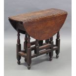 A late 17th/early 18th century joined oak small oval gate-leg table, fitted end drawer, on