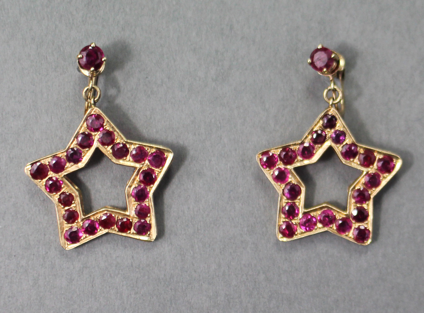 A PAIR OF RUBY PENDANT EARRINGS, each of open five-pointed star shape set twenty round-cut stones of - Image 2 of 4