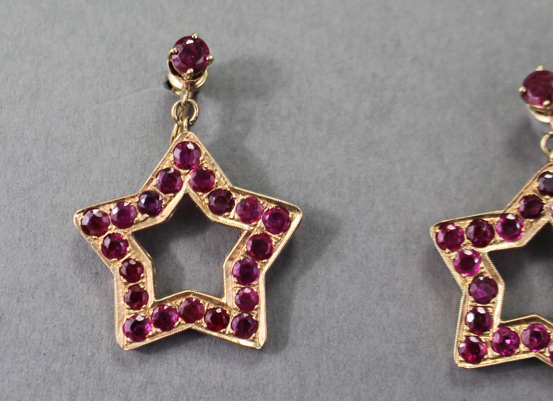 A PAIR OF RUBY PENDANT EARRINGS, each of open five-pointed star shape set twenty round-cut stones of - Image 3 of 4