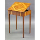 A contemporary teak work/reading table made by John Sheaff Esq., the rectangular lift-top