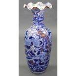 A Chinese porcelain large ovoid vase with flared scalloped rim, decorated in underglaze blue & colo