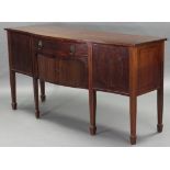 A George III inlaid-mahogany serpentine-front sideboard, with rosewood crossbanding to the top above