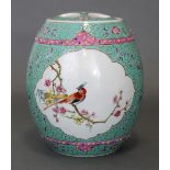 A Chinese porcelain barrel-shaped jar & cover, of turquoise ground & decorated in famille rose