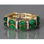 A GOLD, JADE, & DIAMOND BRACELET, the central part set five pairs of oval jade cabochons divided