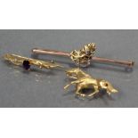 A 9ct. gold brooch in the form of a trotting horse (3.2 gm); a 9K bar brooch set amethyst & seed