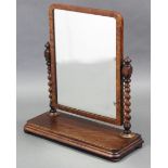 A Victorian mahogany swing toilet mirror, the rectangular plate on spiral-turned supports & plinth