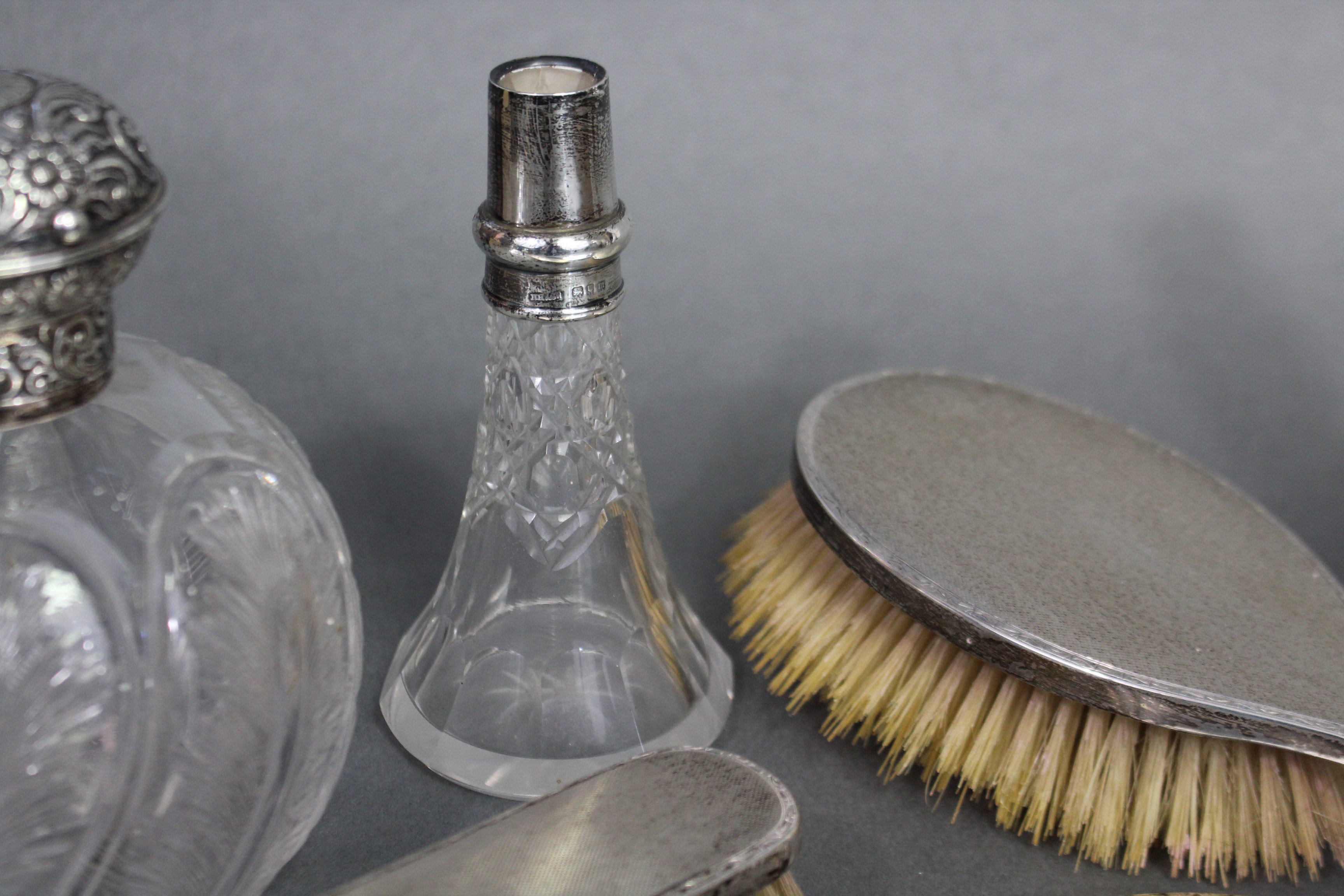 A late Victorian glass spherical toilet-water bottle with finely cut feather motifs, the embossed - Image 3 of 5