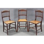 A set of three Victorian bedroom chairs with moulded top rails, turned supports & cane seats.