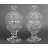 A pair of 19th century hobnail pattern cut glass honey jars of urn form, each with domed cover