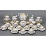 A 19th century Paris porcelain white ground fifty-four piece part tea service, with settings for