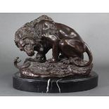 After Antoine-Louis Barye; a cast bronze model of “Lion & Serpent”, on oval marble base; 11” wide