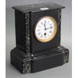 A late 19th century French mantel timepiece in black slate & green marble case, the 3½” diam.