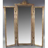A 19th century triple-panel giltwood & gesso folding dressing mirror, the central rectangular
