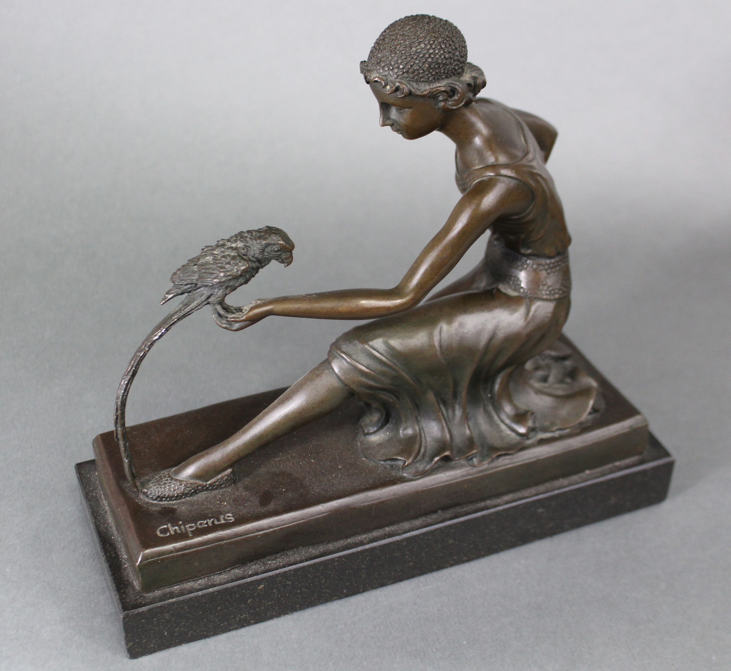 After D. H. Chiparus; a cast bronze figure of a girl in 1930s dress, on one knee feeding a parrot, - Image 2 of 2