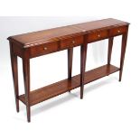 A Multiyork mahogany-finish console table, fitted four frieze drawers, & on square tapered legs, 58”