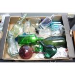 Approximately twenty various coloured & plain glass bottles; together with various items of