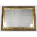A large gilt frame rectangular wall mirror inset bevelled plate, 31” x 43”.