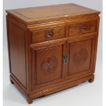 A ditto side cabinet, fitted two frieze drawers above cupboard enclosed by pair of carved panel